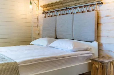 a bed with white pillows in a room at St Anastasia Hotel in Burgas City