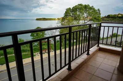 a balcony with a view of the water at Studios Grace - Port Tsarevo in Tsarevo