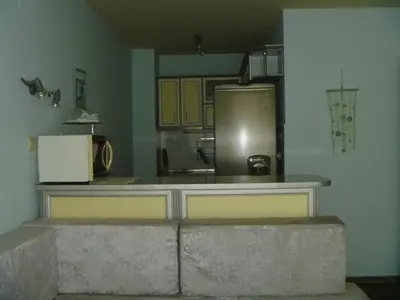 a kitchen with a counter top and a refrigerator at Apartments Lucky Complex Ravda in Ravda