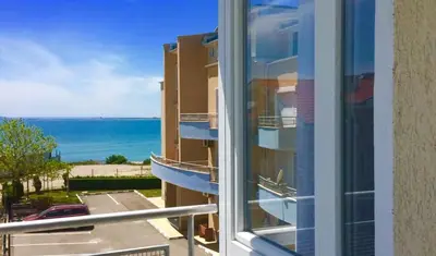 a view of the ocean from a balcony of a building at Apartments Lucky Complex Ravda in Ravda