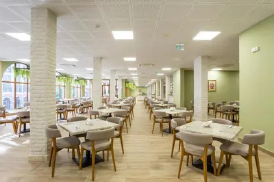 a dining room with tables and chairs at Festa Via Pontica in Pomorie