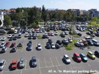 a parking lot filled with lots of parked cars at 4U Apartment - Gurko in Burgas City