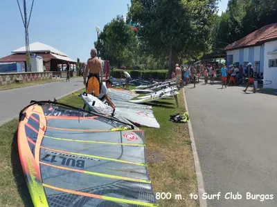 a group of surfboards lined up on the side of a road at 4U Apartment - Gurko in Burgas City