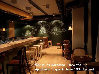 a restaurant with a bar with a mural on the wall at 4U Apartment - Gurko in Burgas City