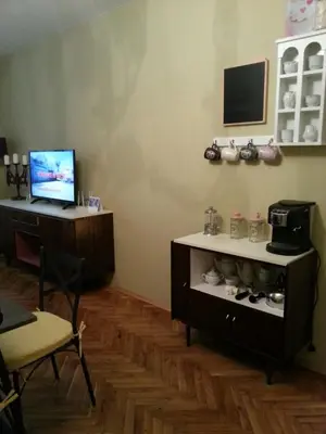 a room with a shelf with shoes in it at Florata apartment in Burgas City