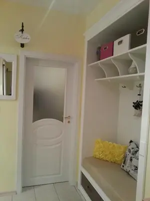 a room with a white door and a shelf at Florata apartment in Burgas City