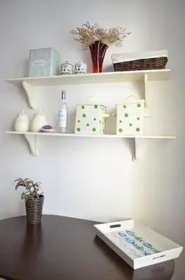 a table with a tray on a shelf at ART Apartments - Pomorie in Pomorie