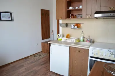 a kitchen with a white stove and a white dishwasher at ART Apartments - Pomorie in Pomorie