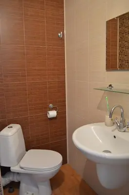 a bathroom with a toilet and a sink at ART Apartments - Pomorie in Pomorie