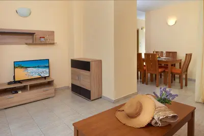 a living room with a hat sitting on a table at Pollo Resort in Sunny Beach
