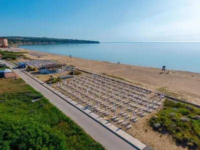 an overhead view of a beach with umbrellas at Sunrise All Suites Resort- All Inclusive in Obzor