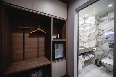 a bathroom with a shower and a toilet at Saint George Hotel & Medical Spa in Pomorie