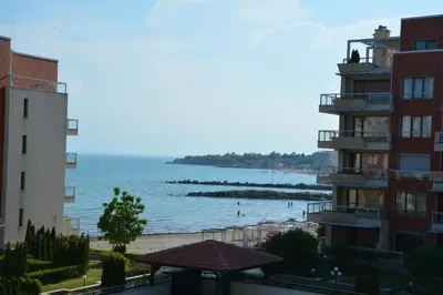 a view of the beach from a building at Apartments Helios in Pomorie