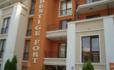 a building with a sign that reads hotel coronel at Sea View Apartment PRESTIGE FORT BEACH , PREMIER FORT BEACH in Sveti Vlas