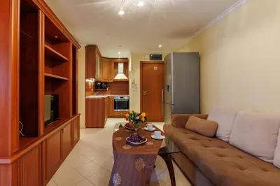 a living room with a couch and a table at Apartments DreamBG in Sozopol