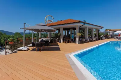 a deck with a swimming pool and a gazebo and a swimming pool at Apartments DreamBG in Sozopol