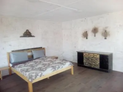 a bedroom with a bed and a fireplace at Apartments Stefanov in Byala in Byala