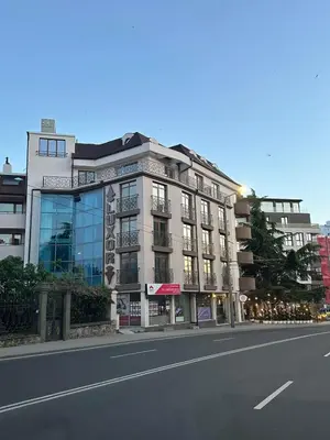 a building on the side of a city street at Hotel Luxor in Burgas City
