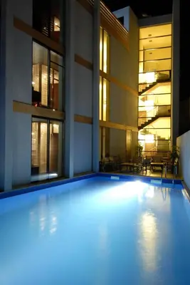 an empty swimming pool in a building at night at Design Hotel Logatero in Sozopol