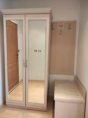 a closet with a glass door in a room at Avalon Apartament in Sunny Beach