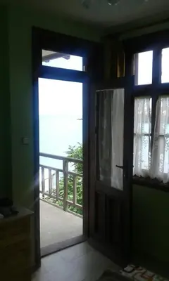 an open door with a view of a balcony at Agalina Sea House in Sozopol