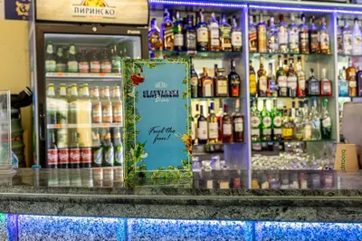 a store with a lot of bottles of alcohol at Hotel Slavyanski in Sunny Beach