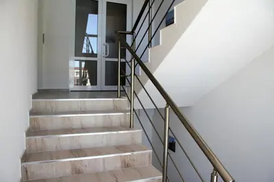 a staircase in a house with a glass door at CAPUCCINO GUEST APARTMENTS - FREE PARKING and Wi-Fi in Sunny Beach