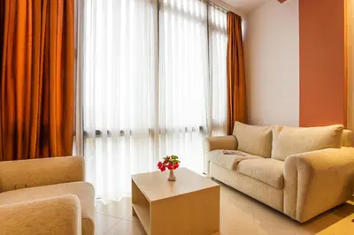 a living room with a couch and a table at Family Hotel Gold Pearl in Sunny Beach