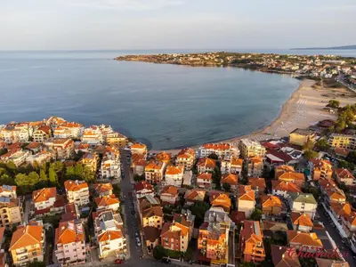 an aerial view of a city and the beach at Hotel Chuchulev in Sozopol