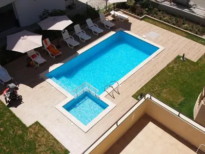 an overhead view of a swimming pool in a backyard at Hotel Milan in Primorsko