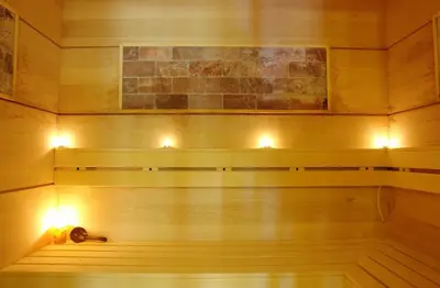 a sauna with lights on a wooden wall at Edmond Apartment-Highspeed-Internet-Free! in Aheloy