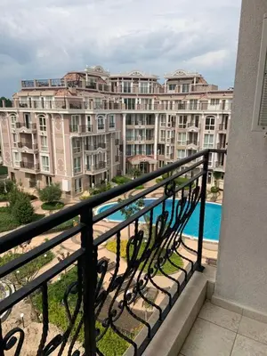 a balcony with a view of a large building at Dawn Park Complex in Sunny Beach