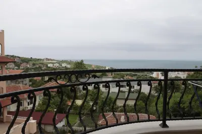 a balcony with a view of the ocean at Guest House Palazzo in Byala