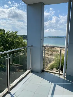 an open balcony with a view of the ocean at Hotel Kamenec in Kiten