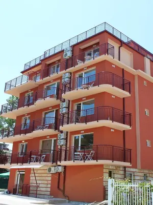 an orange building with balconies on it at Hotel Sapphire in Primorsko