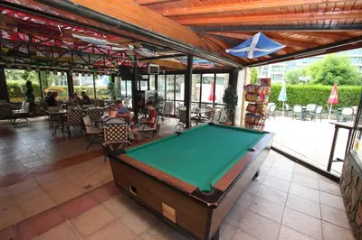 a pool table in the middle of a patio at Friends Family Hotel in Sunny Beach