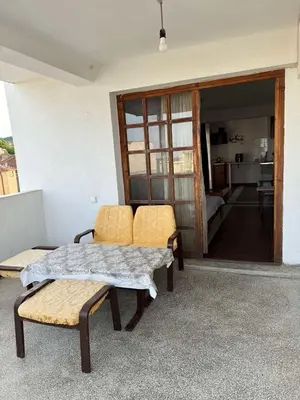 a room with two chairs and a table and a living room at obzor, orkinos in Obzor
