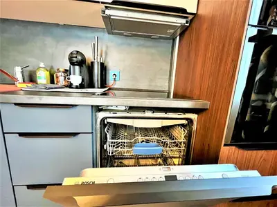a kitchen with an oven with a cage in it at Bravo 5 Holiday Home in Sunny Beach