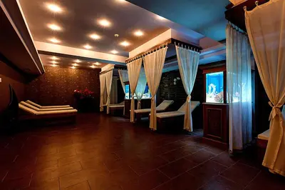 a room with bunk beds and a tv in it at Primoretz Grand Hotel & Spa in Burgas City