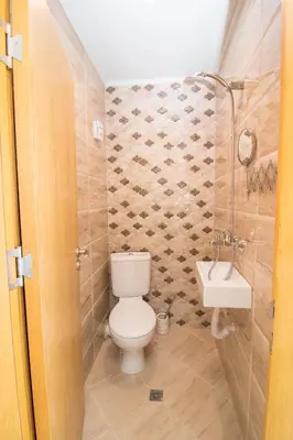 a bathroom with a toilet and a sink at Soulful Apartments - Horizon in Varna City