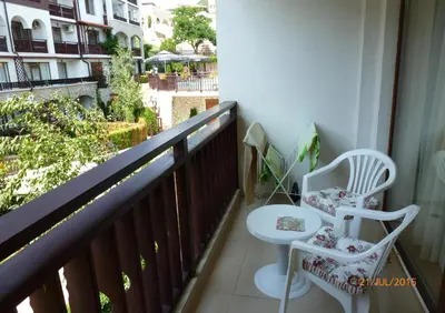 a balcony with two chairs and a toilet on it at Arena 65m2 - 1 bedroom, 1st line to the beach in Sveti Vlas
