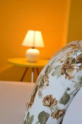 a close up of the back of a chair with a lamp at Villa Valentines in Kiten