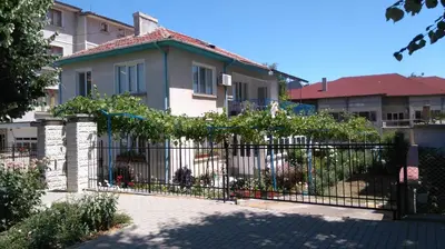 a fence in front of a house at Песента на морето in Obzor