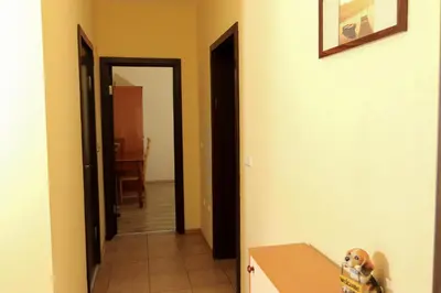 a hallway with a door leading into a room at Complex Sozopol Dreams BMT in Sozopol