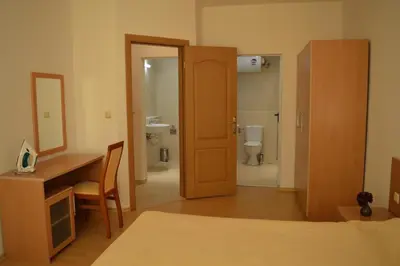 a room with a desk and a bathroom with a toilet at Apartment Konstantin in Trakia Plaza in Sunny Beach