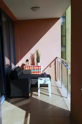 a living room with a couch and a table at Apartment Konstantin in Trakia Plaza in Sunny Beach