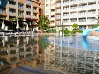 a swimming pool in the middle of a building at Apartment Konstantin in Trakia Plaza in Sunny Beach