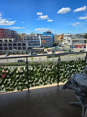 a balcony with a view of a city with buildings at Apartment Konstantin in Trakia Plaza in Sunny Beach