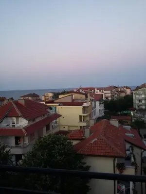 a group of buildings with red roofs at Guest House Adriya in Primorsko