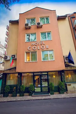 a hotel building with a hotel colors sign on it at Hotel Color in Varna City